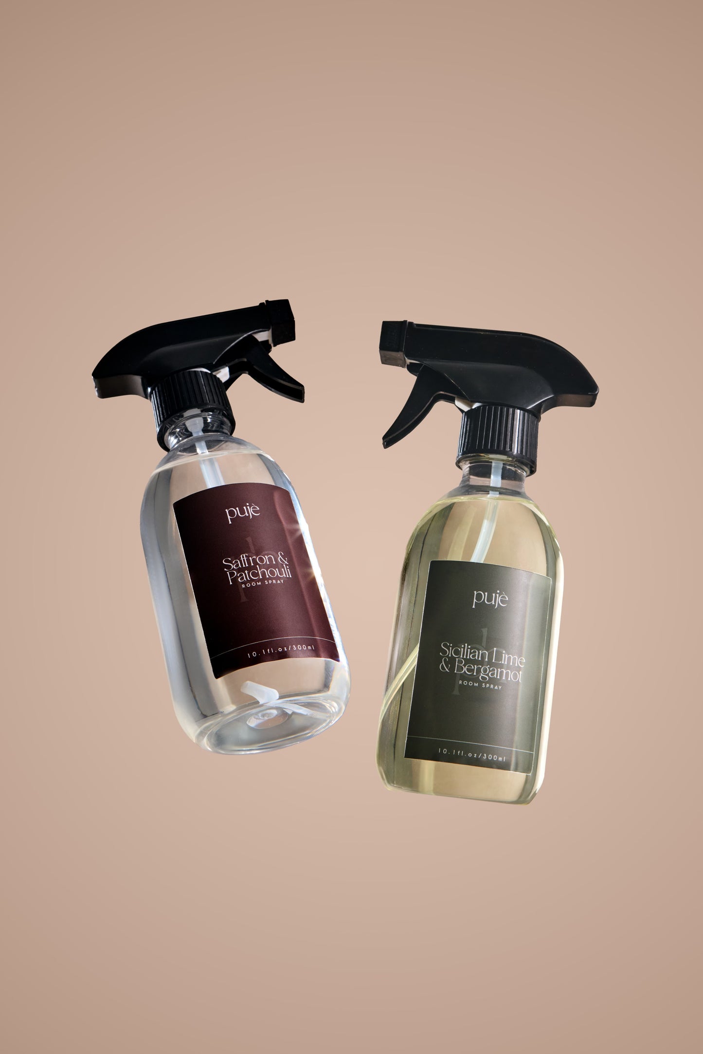 Two Room Sprays in  PET bottles. 
 One with a green label that reads " Sicilian Lime & Bergamot" scented  and another with a brown label that reads " Saffron & Patchouli " scented.